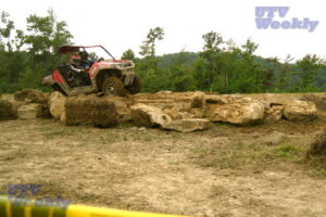 A RZR trying to rock crawl.