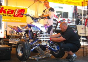 Elka's Tony Cuva working on shock adjustments Elka's Tony Cuva working on shock adjustments