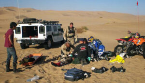 Sand Dunes Injury BORSTAR team members assist a man injured while riding an off-road vehicle at the Imperial Sand Dunes in southeastern California